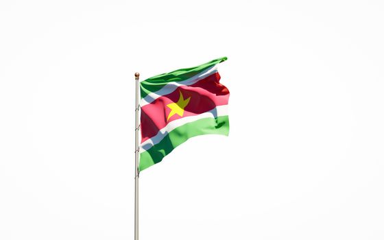 Beautiful national state flag of Suriname on white background. Isolated close-up Suriname flag 3D artwork.