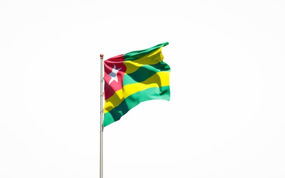 Beautiful national state flag of Togo on white background. Isolated close-up Togo flag 3D artwork.