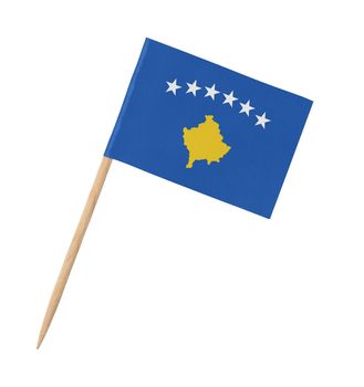 Small paper flag of Kosovo on wooden stick, isolated on white
