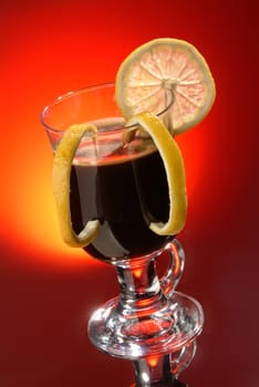 Cup of coffee with lemon on a glass