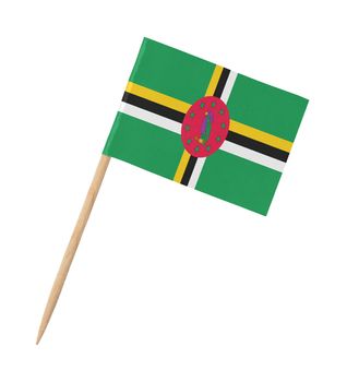 Small paper flag of Dominica on wooden stick, isolated on white