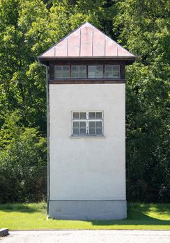 Dachau, Germany - July 13, 2020: Single watch tower at Dachau Concentration camp, Germany