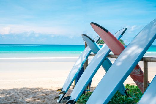 Many surfboards for rent  at summer beach with sunlight  blue sky background. 