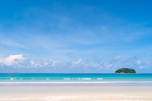 Tropical nature clean beach and white sand in summer season with sun light blue sky background.