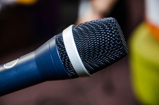 Microphone on abstract blurred of speech in seminar room or speaking conference hall light, Event Background