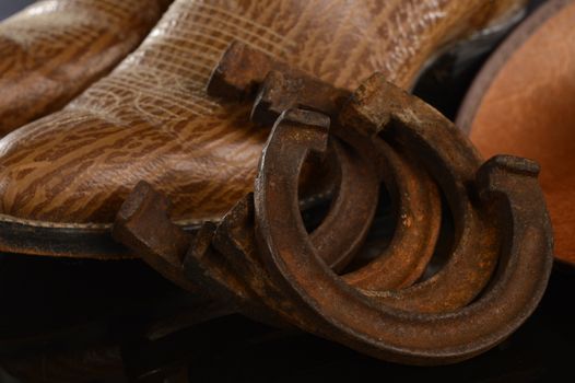 Closeup image of a full set of retro horse shoes for a small colt or a pony.
