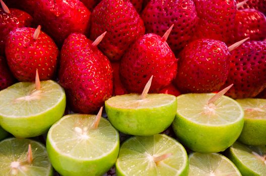 Fresh natural red strawberries and sliced lemon