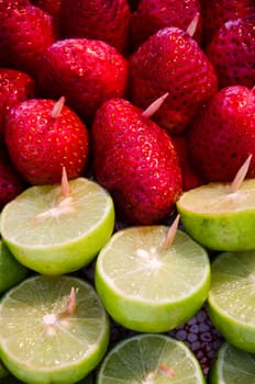 Fresh natural red strawberries and sliced lemon