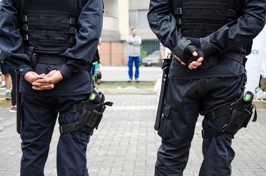 Leg of a policeman in which a firearm is found, concept of security