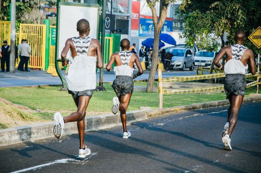 Lima, Peru - May 20th 2018: Marathon Lima 42k, sporting event that gathers athletes from all over the world. Elite athletes stretching before the marathon.