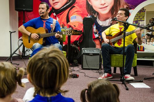 Lima, Peru - May 25th 2018: Musical Band for children Troly and El Lobito. The guys singing to children.