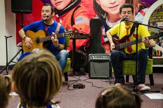 Lima, Peru - May 25th 2018: Musical Band for children Troly and El Lobito. The guys singing to children.