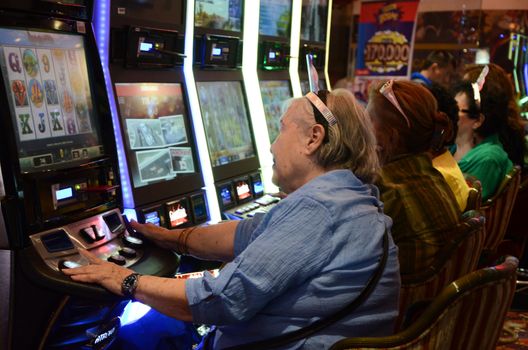 Lima, Peru - January 1st 2017: Slot machines in play room, New Year's Eve 2017 players entertained in slot machines