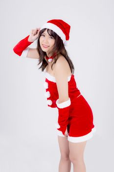 Beautiful portrait young asian woman Santa costume wear hat smiling with happy in holiday xmas, beauty model asia girl cheerful and happiness celebrating in Christmas isolated on white background.