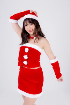 Beautiful portrait young asian woman Santa costume wear hat smiling with happy in holiday xmas, beauty model asia girl cheerful and happiness celebrating in Christmas isolated on white background.