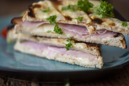 french croque monsieur on a blue plate