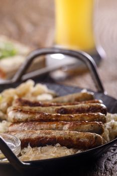 nuremberg sausages in a serving pan