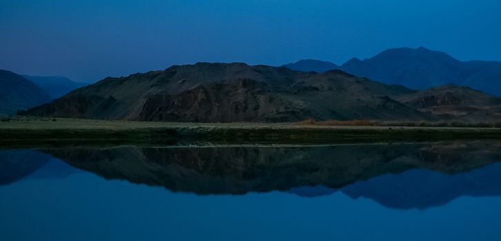 Lake in the Altai Mountains. Panorama of the Altai landscape in the mountains. The time of year is autumn.