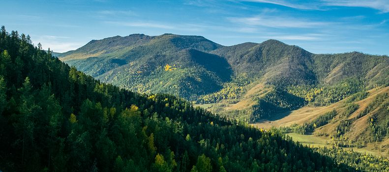 Mountains and hills altai in autumn, panoramic photo. Mountains and hills altai in autumn, panoramic photo.