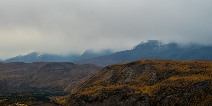 Mountains and hills altai in autumn, panoramic photo. Mountains and hills altai in autumn, panoramic photo.