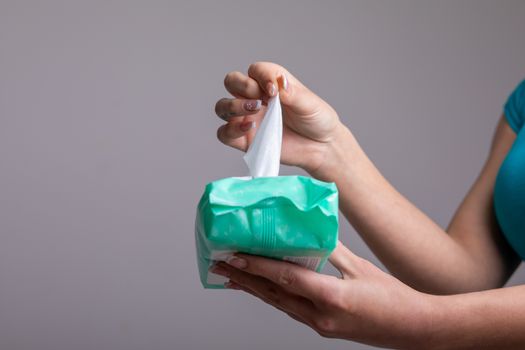 Taking baby wet wipes from the packaging - hygiene procedure and prevention of infectious diseases