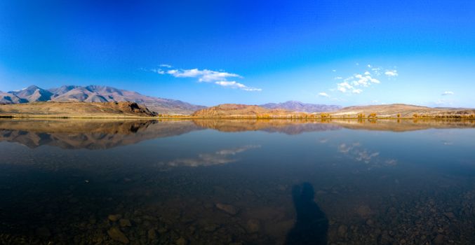 Lake in the Altai Mountains. Panorama of the Altai landscape in the mountains. The time of year is autumn.