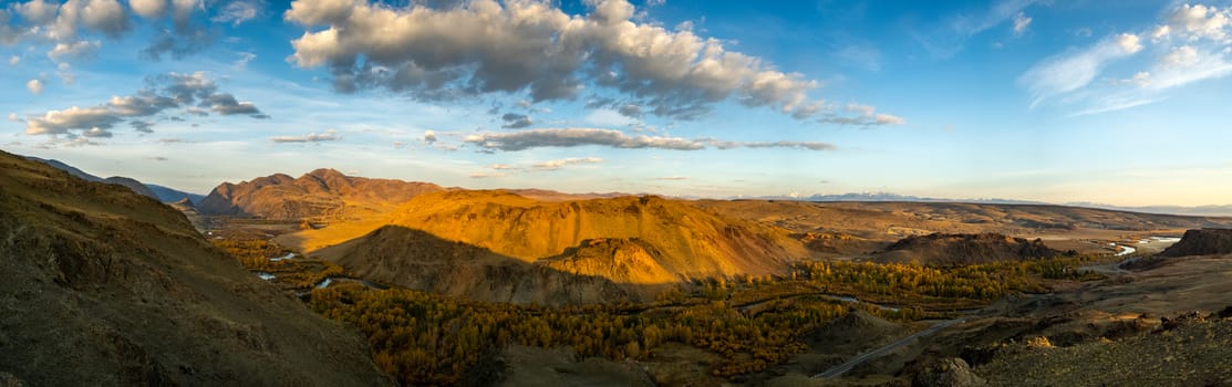 Mountains and hills altai in autumn, panoramic photo. Mountains and hills altai in autumn, panoramic photo.