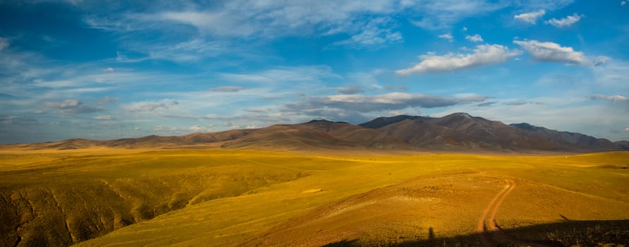Mountains and hills altai in autumn, panoramic photo. Mountains and hills altai in autumn, panoramic photo.