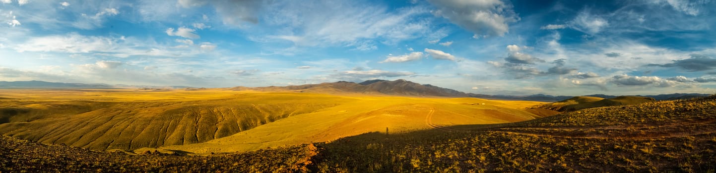 Mountains and hills altai in autumn, panoramic photo. Mountains and hills altai in autumn, panoramic photo.