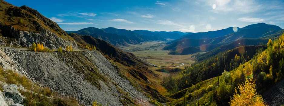 Mountains and hills altai in autumn, panoramic photo. Mountains and hills altai in autumn, panoramic photo.