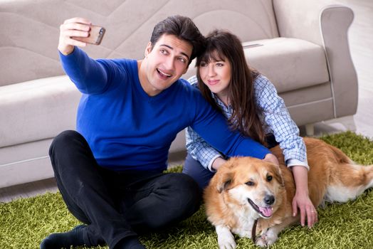 Happy family with golden retriever dog