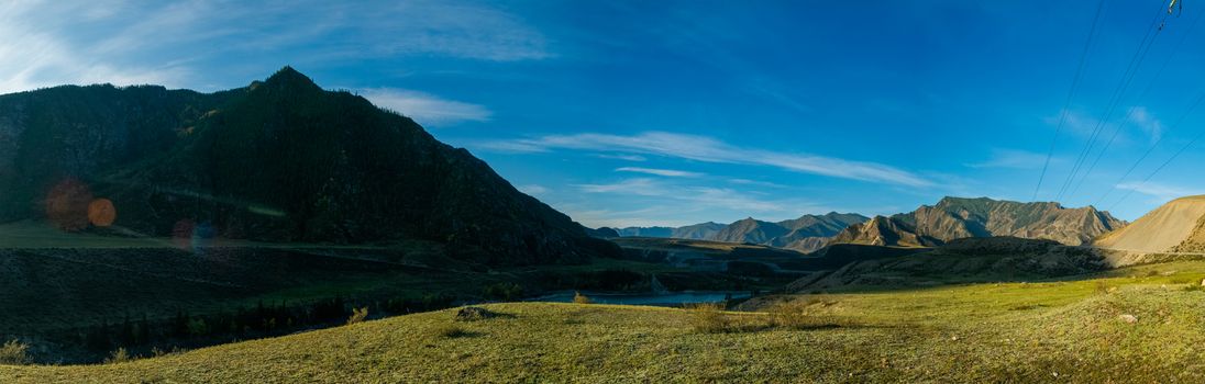 Panorama is the Altai, a mountain river flowing between the Altai mountains and the nature of the area.