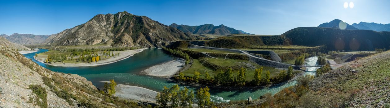 Panorama is the Altai, a mountain river flowing between the Altai mountains and the nature of the area.