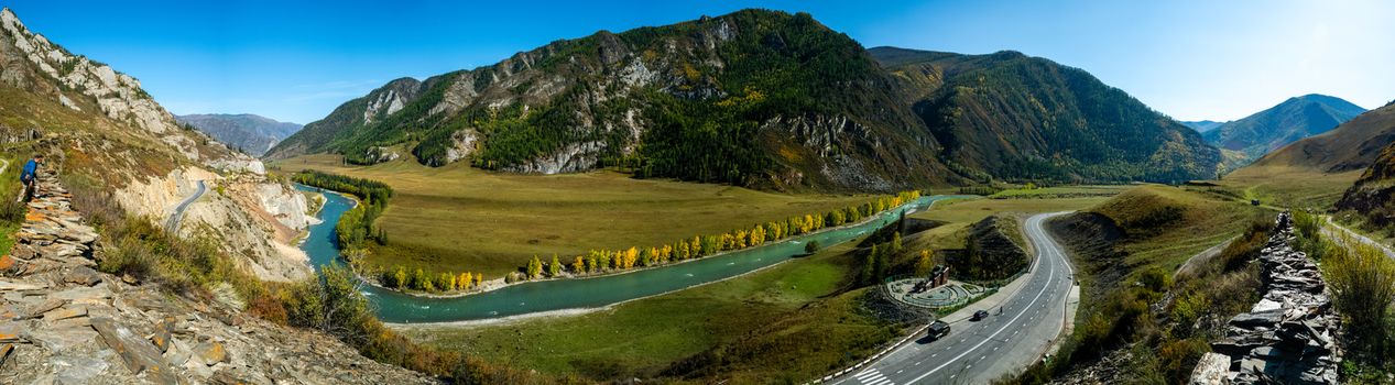 Panorama is the Altai, a mountain river flowing between the Altai mountains and the nature of the area.