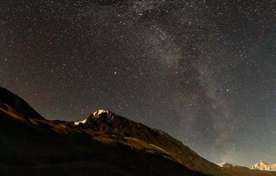 The starry sky above the Altai mountains. Beautiful night sky over the Altai mountains.