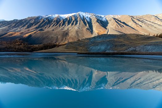 Mountain lake among the mountains on altai. The water surface of the lake.