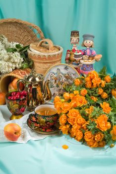 Fruits, flowers and handmade artworks on a canvas background