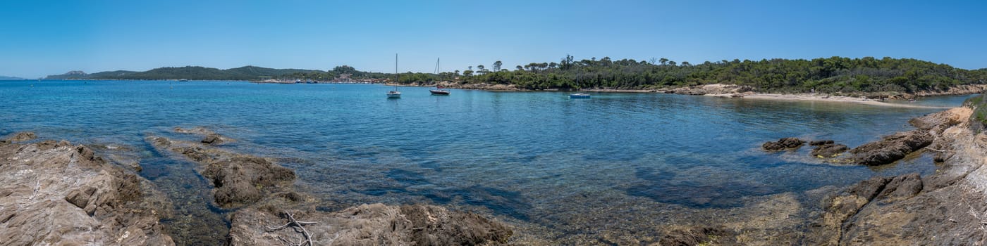 Discovery of the island of Porquerolles in summer. Deserted beaches and pine trees in this landscape of the French Riviera, Var.