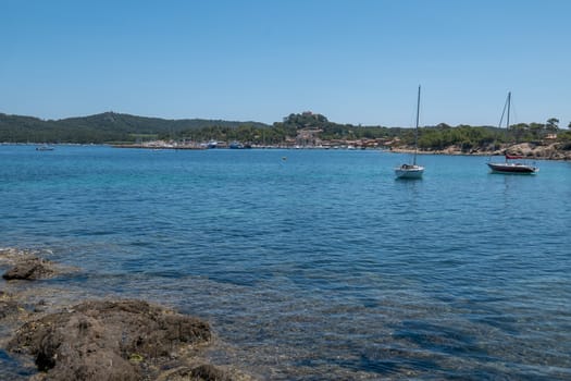 Discovery of the island of Porquerolles in summer. Deserted beaches and pine trees in this landscape of the French Riviera, Var.