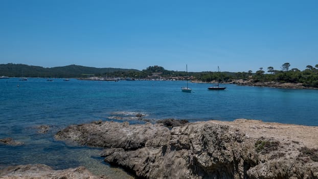 Discovery of the island of Porquerolles in summer. Deserted beaches and pine trees in this landscape of the French Riviera, Var.