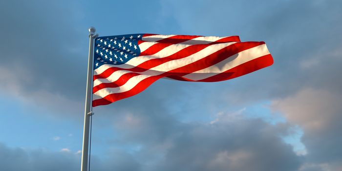 3d rendering of the national flag of the United States of America in the evening at sunset against a background of beautiful clouds