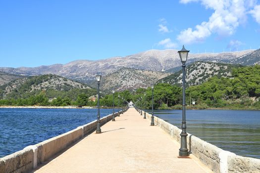 The view along De Bosset Bridge (formerly Drapano Bridge) on the Greek island of Kefalonia.  The bridge spans Koutavos Lagoon in Argostoli.