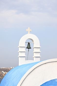 A view of a chapels bell tower on the Greek island of Mykonos.