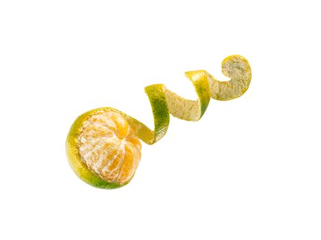 Fresh ripe green mandarine with spiral zest. Half peeled green tangerine isolated on white background with clipping path