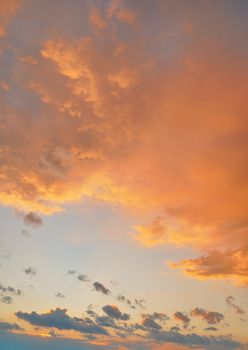 Orange pink evening sky just after sunset - afternoon clouds background.