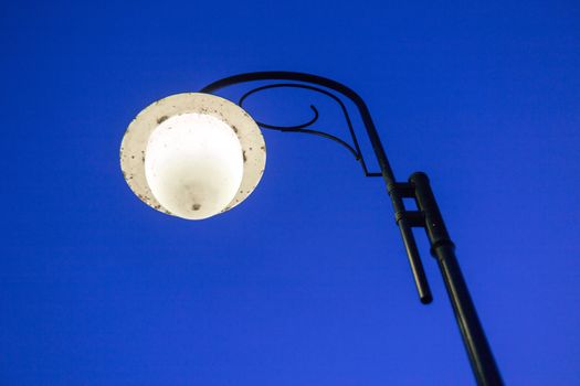 street lamp post on evening deep blue sky