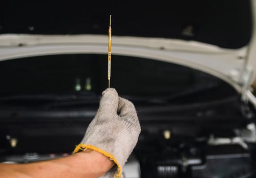 Auto mechanic Repair maintenance Check engine oil level and car inspection