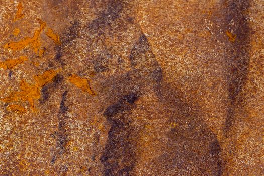 orange rusted iron sheet background with selective focus