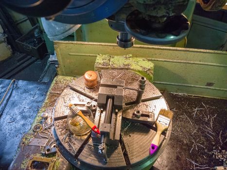 industrial wise on rotating table with metal chips with selective focus