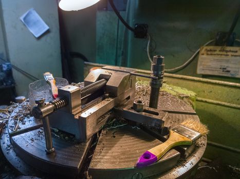 industrial wise on rotating table with metal chips 